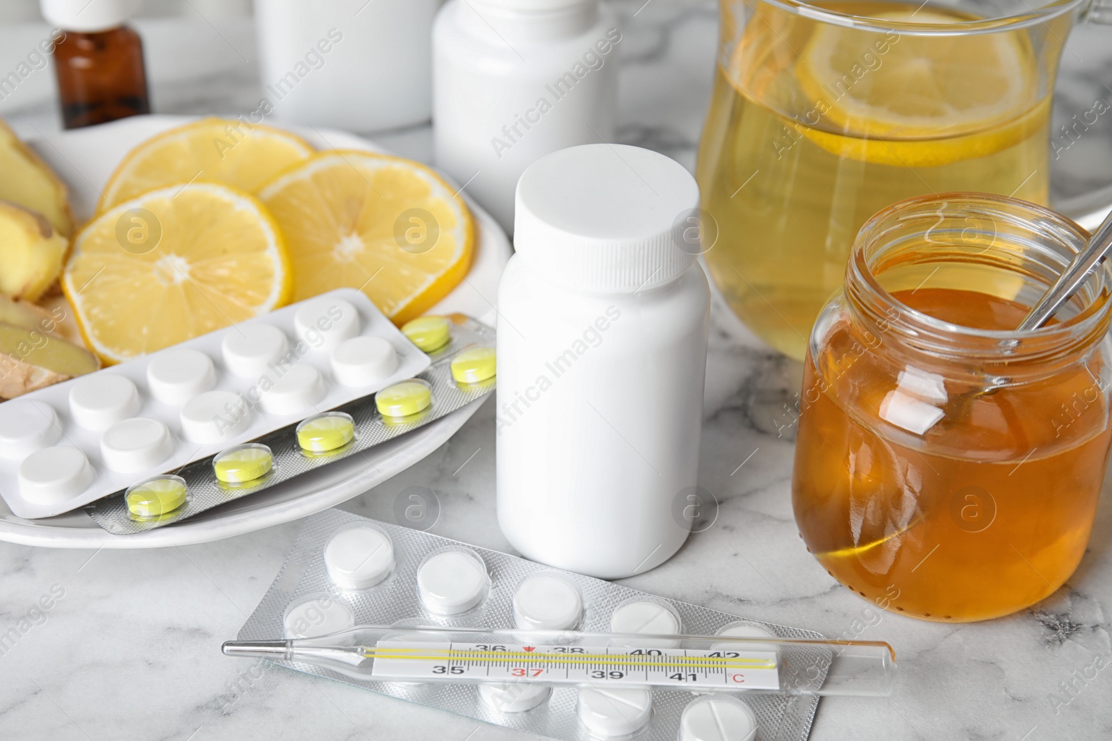 Photo of Set of different cold remedies on white marble table