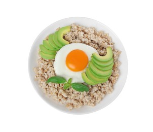 Delicious boiled oatmeal with fried egg, avocado and basil in bowl isolated on white, top view