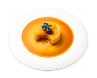 Delicious pudding with caramel on white background