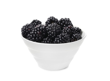 Photo of Ceramic bowl of tasty ripe blackberries on white background