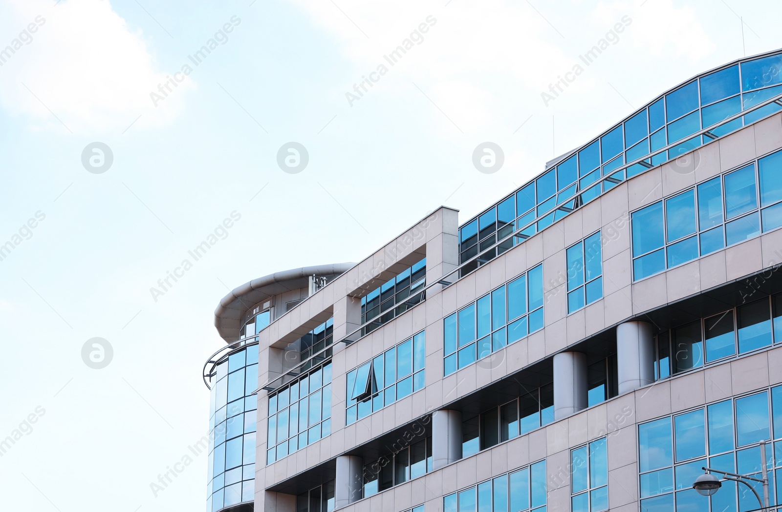 Photo of Building with tinted windows. Modern architectural design