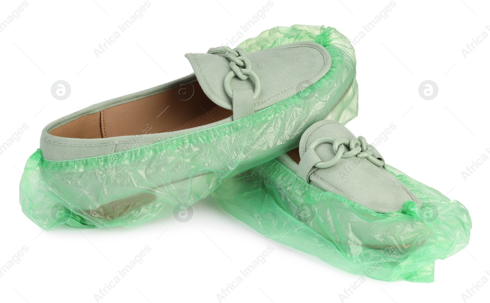 Photo of Women's mules in green shoe covers isolated on white