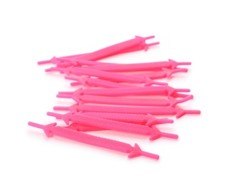 Photo of Pink silicone shoe laces on white background