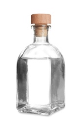 Photo of Glass bottle with vinegar on white background