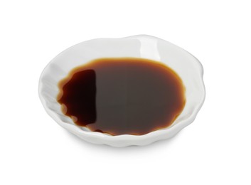 Photo of Tasty soy sauce in bowl isolated on white, above view
