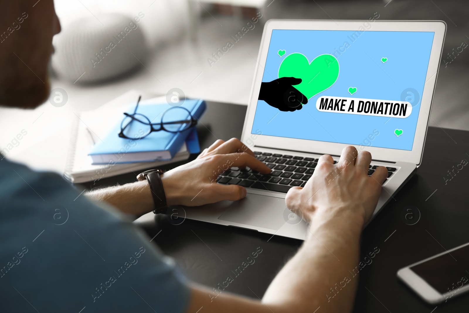 Image of Donations concept. Man with laptop at table, closeup