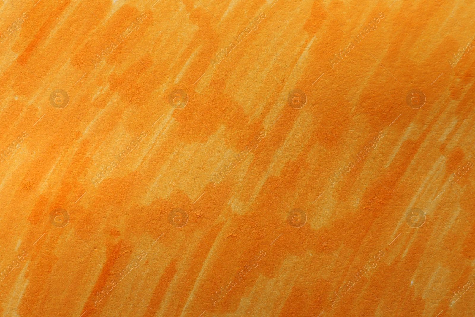 Photo of Abstract painting drawn with orange marker as background, top view
