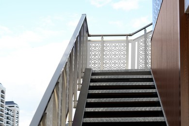 Photo of View of metal outdoor stairs with railing