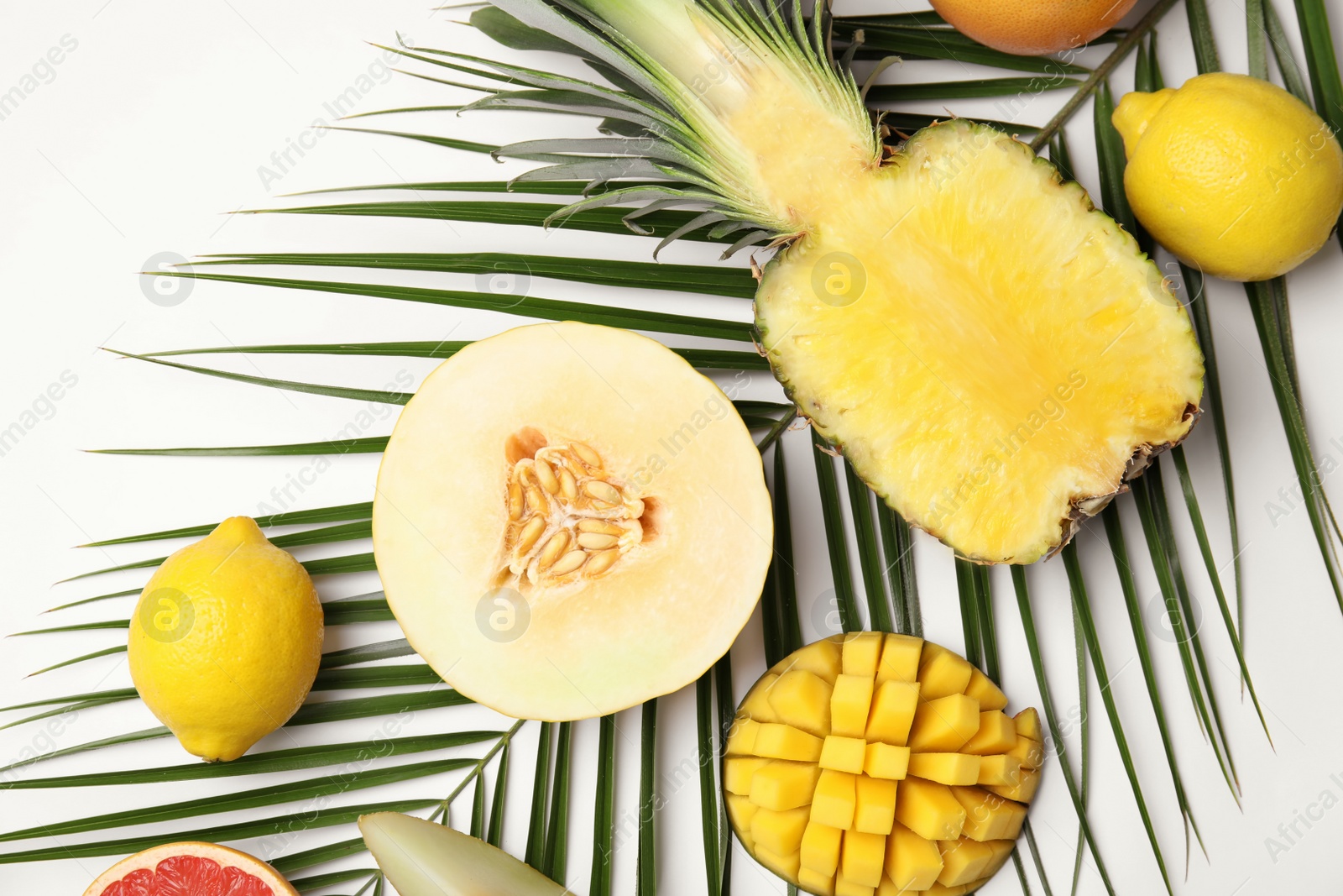 Photo of Flat lay composition with melon and other fruits on white background