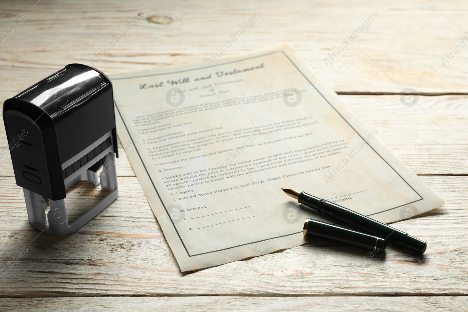 Photo of Last Will and Testament with stamp and pen on white wooden table