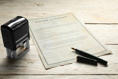 Photo of Last Will and Testament with stamp and pen on white wooden table