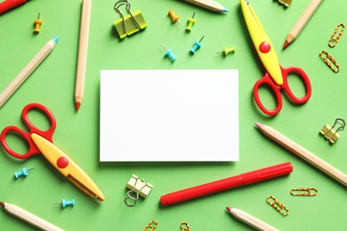 Photo of Flat lay composition with scissors and school supplies on color background. Space for text