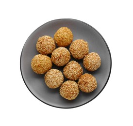 Plate of delicious sesame balls on white background, top view
