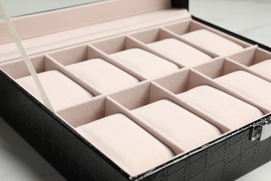 Photo of Stylish empty jewelry box on table, closeup