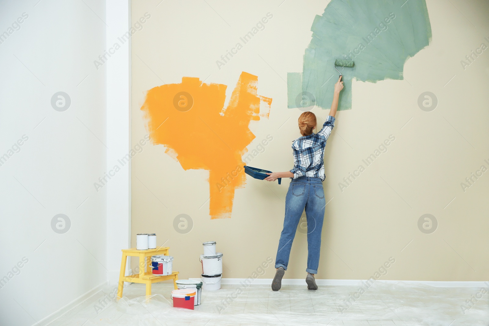 Photo of Woman painting wall indoors, space for text. Home repair