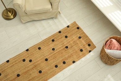 Photo of Stylish rug on floor in room, above view