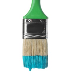 Photo of Brush with green paint on white background, closeup