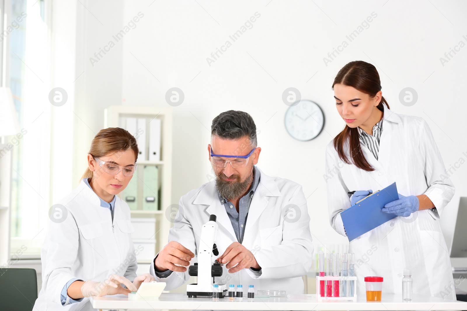 Photo of Scientists working in laboratory. Research and analysis