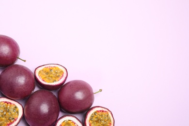 Photo of Fresh ripe passion fruits (maracuyas) on light background, flat lay. Space for text