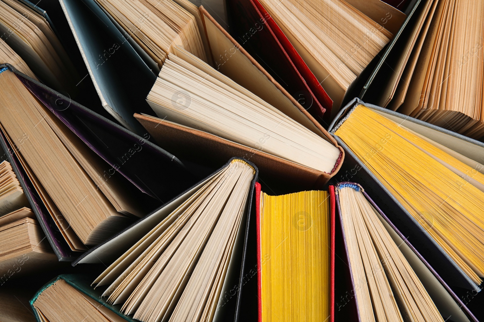 Photo of Stack of hardcover books as background, top view