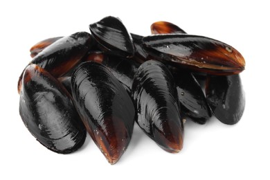 Heap of raw mussels in shells on white background