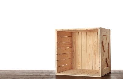 Photo of Wooden crate on table against white background. Space for text