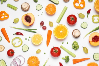 Fresh organic fruits and vegetables on white background, flat lay