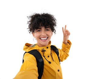 Beautiful woman taking selfie on white background