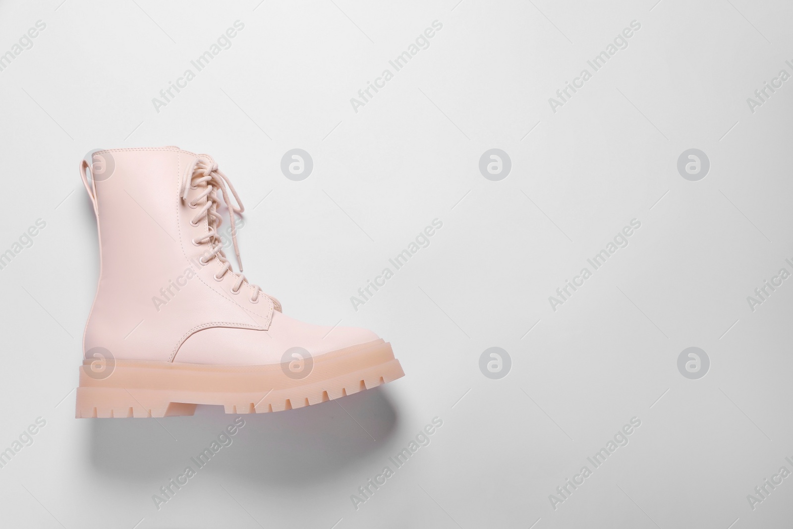 Photo of Stylish leather shoe on white background, top view. Space for text