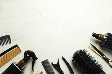 Photo of Hairdressing tools on light background, flat lay. Space for text