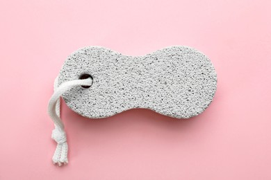 Photo of White pumice stone on pink background, top view