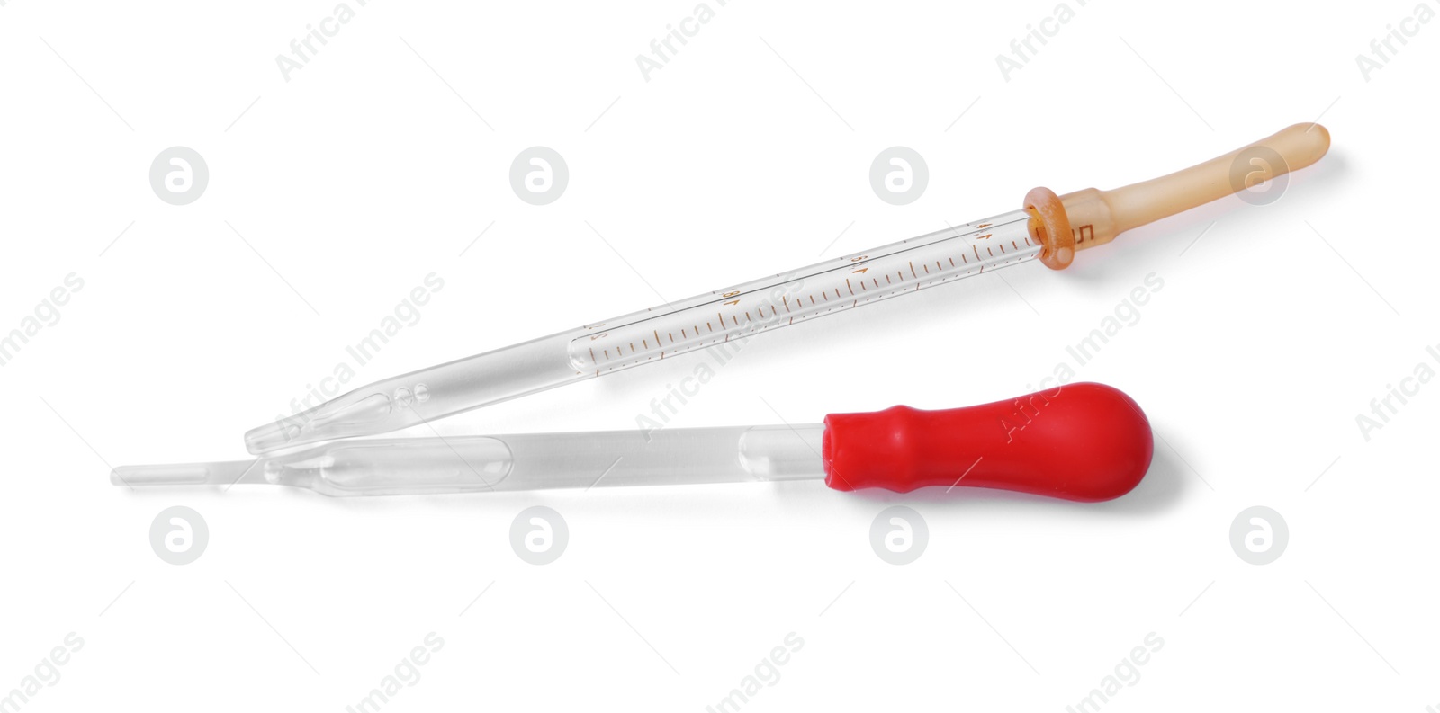 Photo of Two pipettes with liquid isolated on white, top view