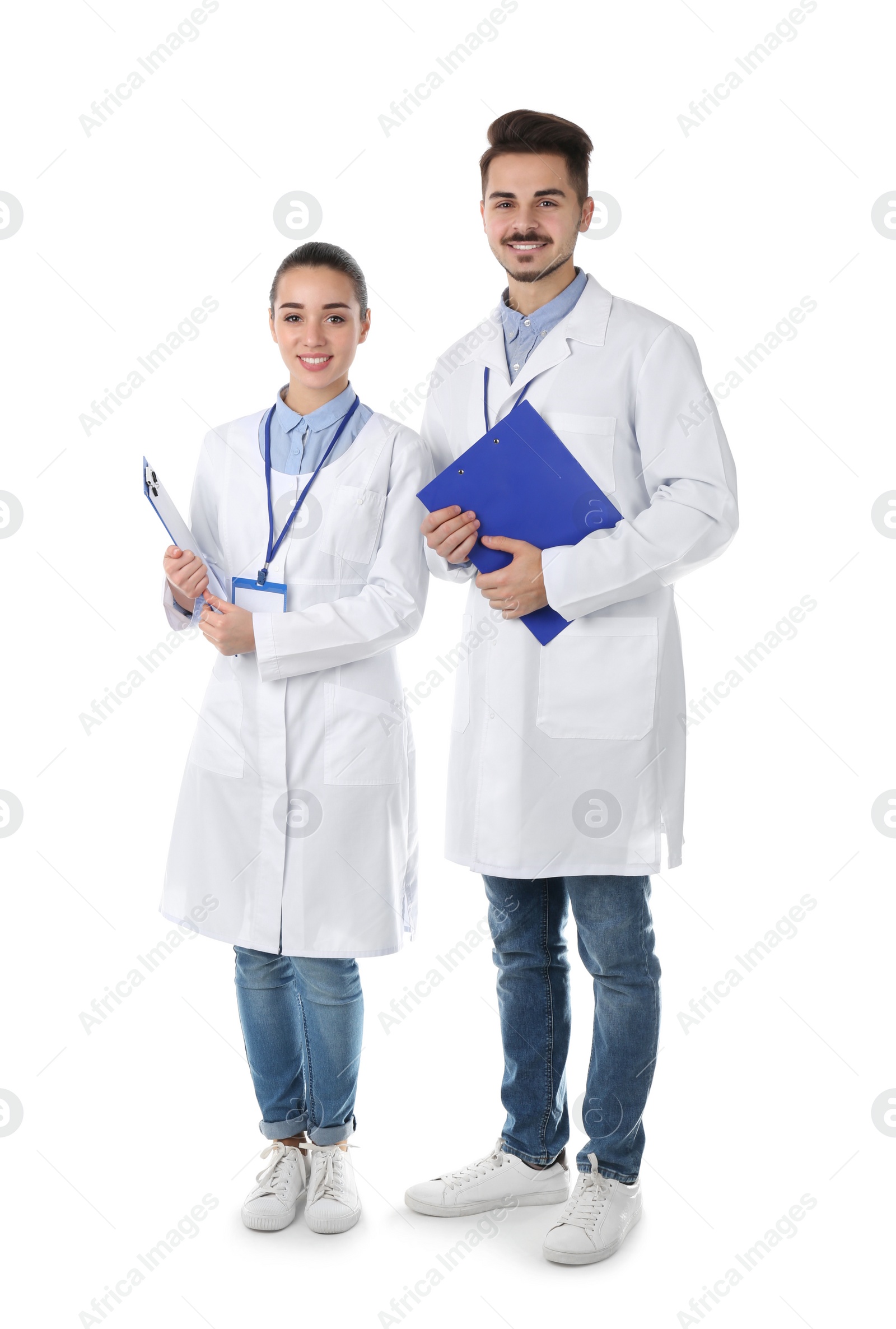 Photo of Happy young medical students on white background