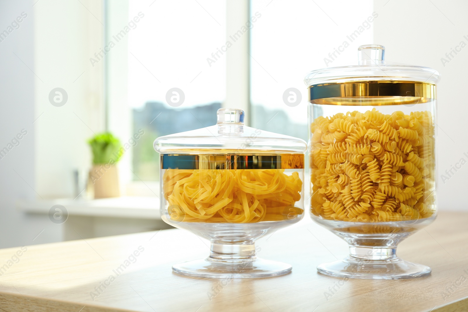 Photo of Products in modern kitchen glass containers on wooden table
