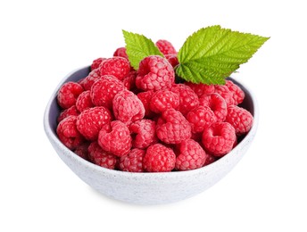 Photo of Bowl of fresh ripe raspberries with green leaves isolated on white