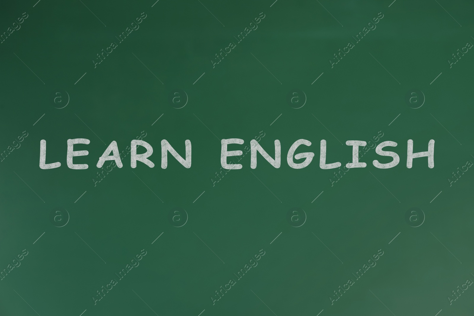 Image of Green chalkboard with text Learn English 
