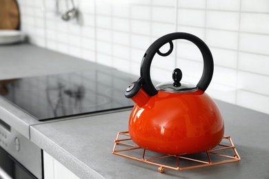 Photo of Modern kettle on kitchen counter indoors, space for text