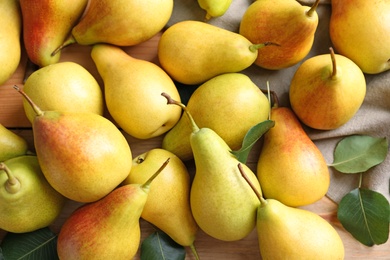 Many ripe pears on table, top view