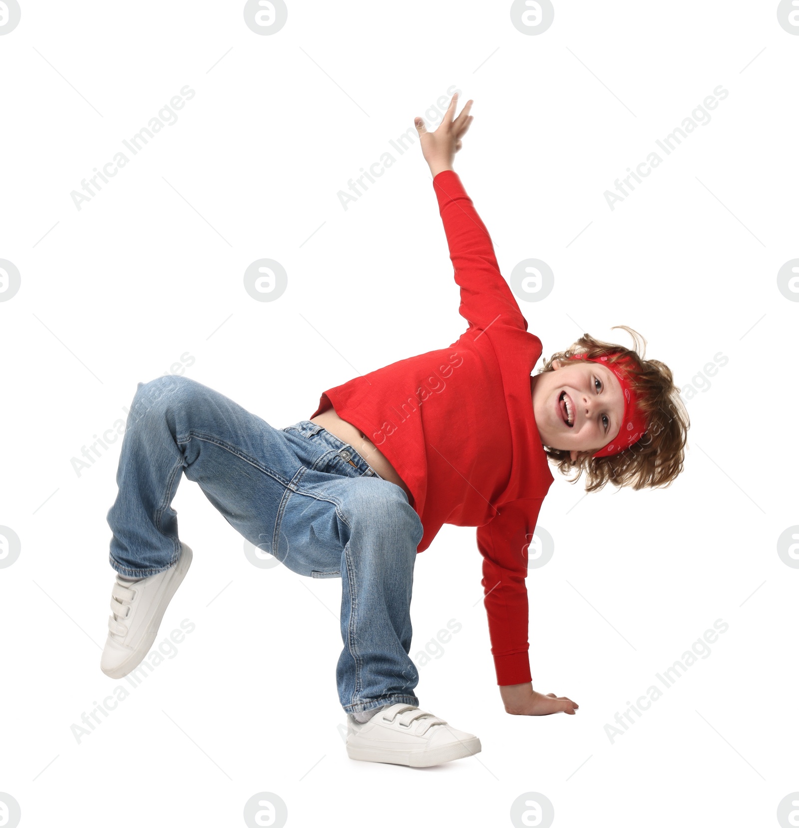 Photo of Happy little boy dancing on white background