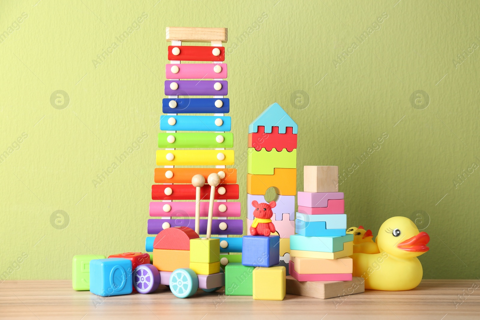 Photo of Set of different toys on wooden table