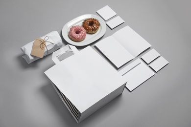 Photo of Composition with items for mock up design on gray background. Food delivery service