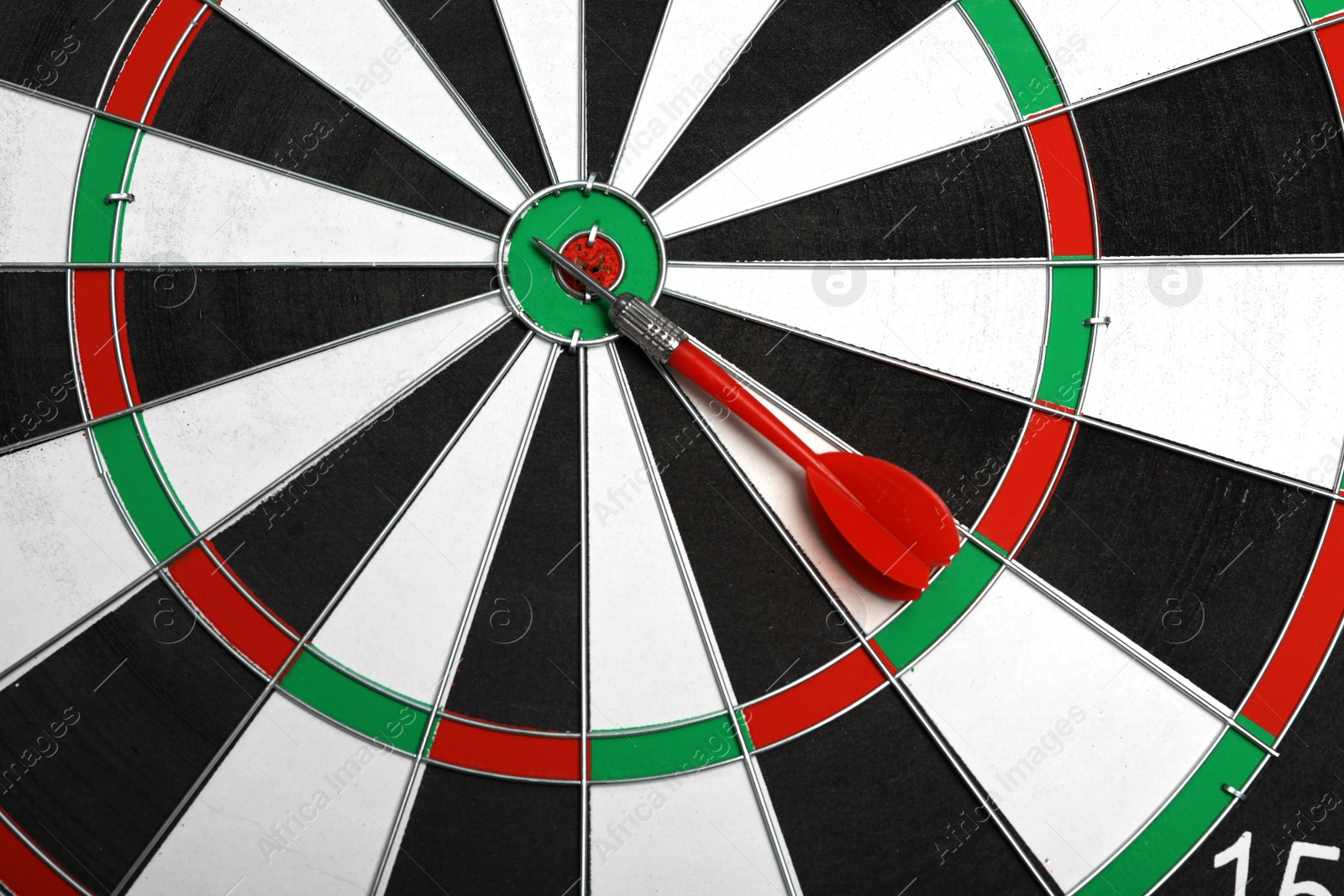 Photo of Closeup of dart board with color arrow, top view