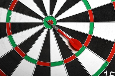 Photo of Closeup of dart board with color arrow, top view