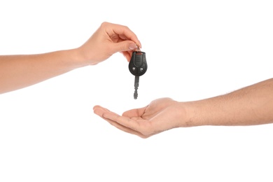Photo of Agent giving car key to man on white background, closeup. Getting driving license