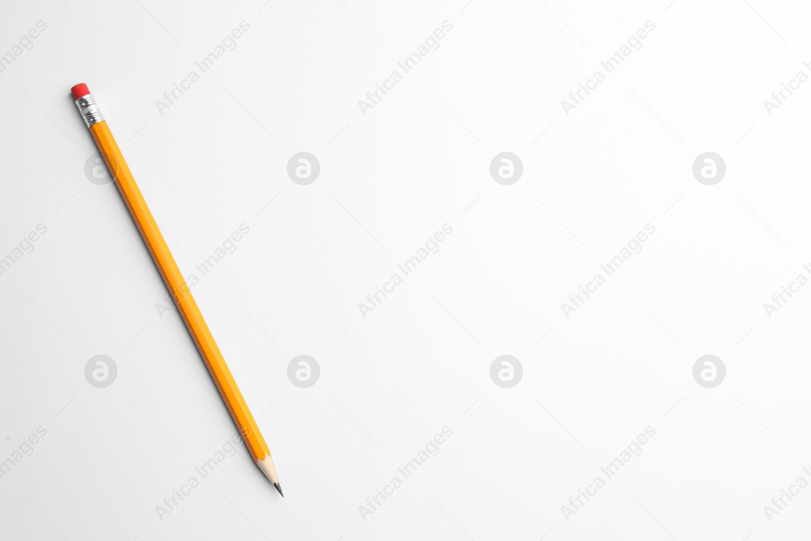 Photo of Sharp graphite pencil with eraser on white background, top view. Space for text