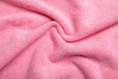 Crumpled pink microfiber cloth as background, closeup