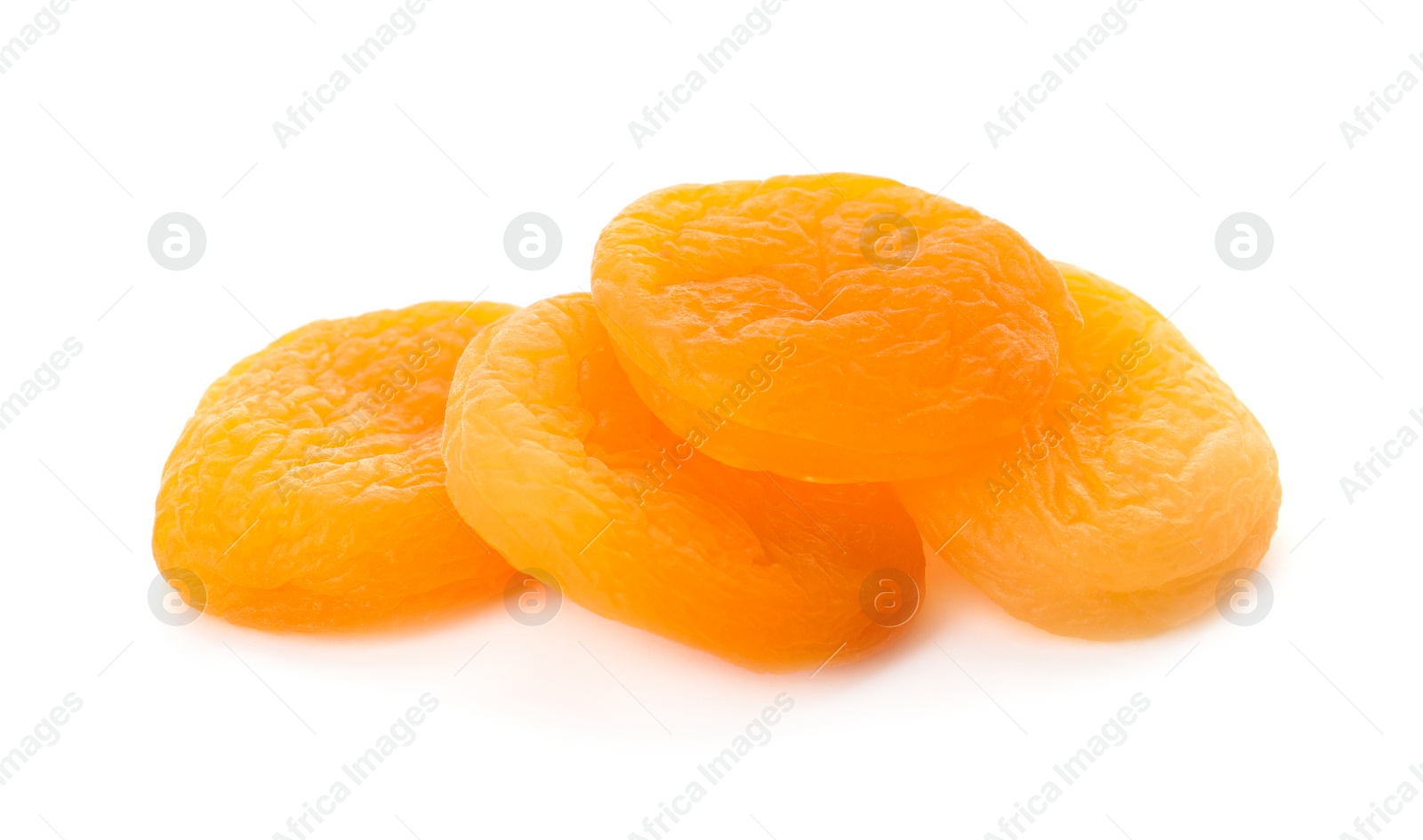 Photo of Pile of tasty apricots on white background. Dried fruits