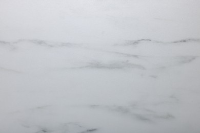 Photo of Texture of white marble surface as background, closeup