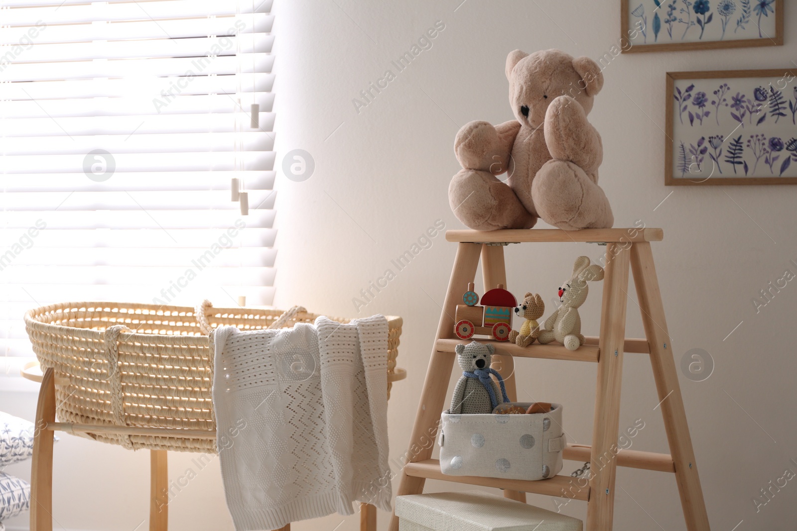 Photo of Decorative ladder with toys and different stuff in stylish baby room. Idea for interior design