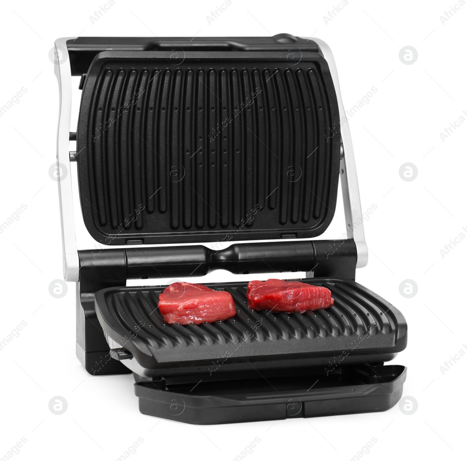 Photo of Electric grill with raw meat steaks isolated on white